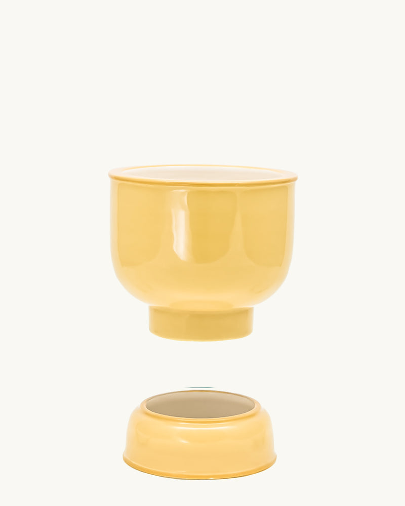 Yellow integrated ceramic pot and drip plate set. Planter designed by Nueve Design Studio PH.